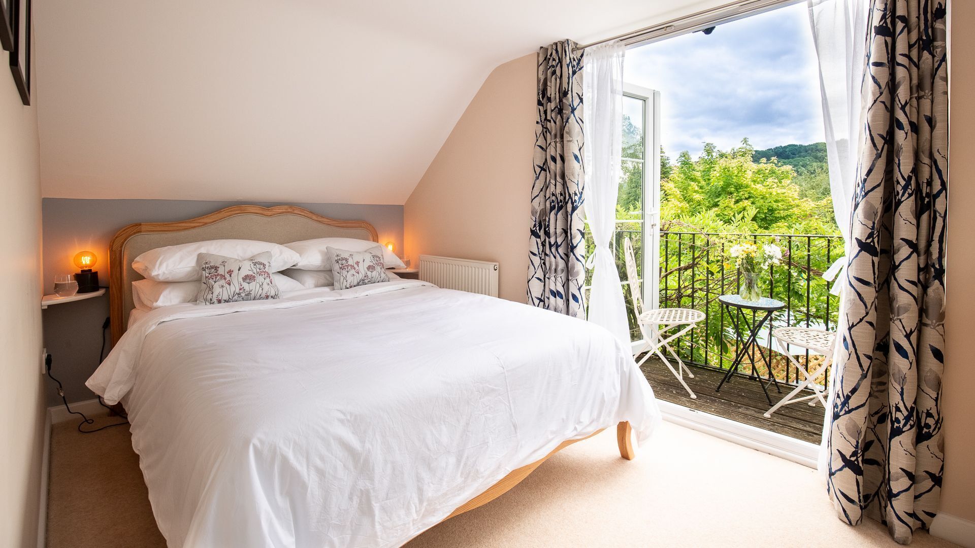 The master bedroom is elegantly styled and features a king-size bed.