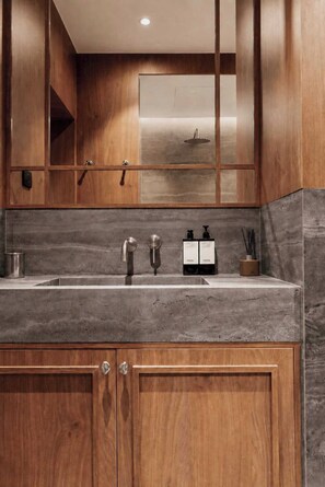A modern kitchen with wooden cabinets, a granite countertop, and stainless steel fixtures. - Stunning A/C Flat -1bdr/4p- Saint-germain-des-pres (Paris)