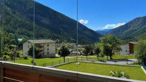 A mountain view with a clear sky, a building labeled 'Sternblick,' and a well-maintained lawn. - Majesta Leukerbad # 6-bed apartment, Dusche oder Bad, WC by Interhome (Leukerbad)