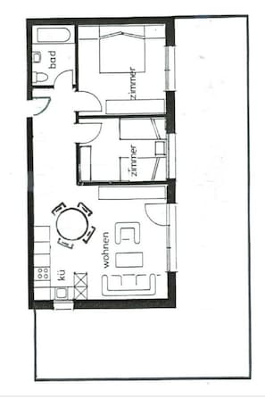 Ein Grundriss mit Wohnzimmer, zwei Schlafzimmern, einem Badezimmer und einer Küche.