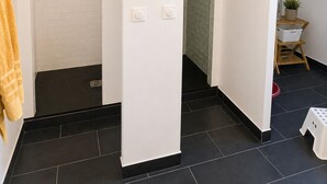 A modern bathroom with a shower, a white door, and a chandelier. - KER MI NAT': A large family home in the heart of Vannes, (Vannes)
