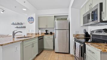 Coffee/tea maker, fridge, microwave, oven