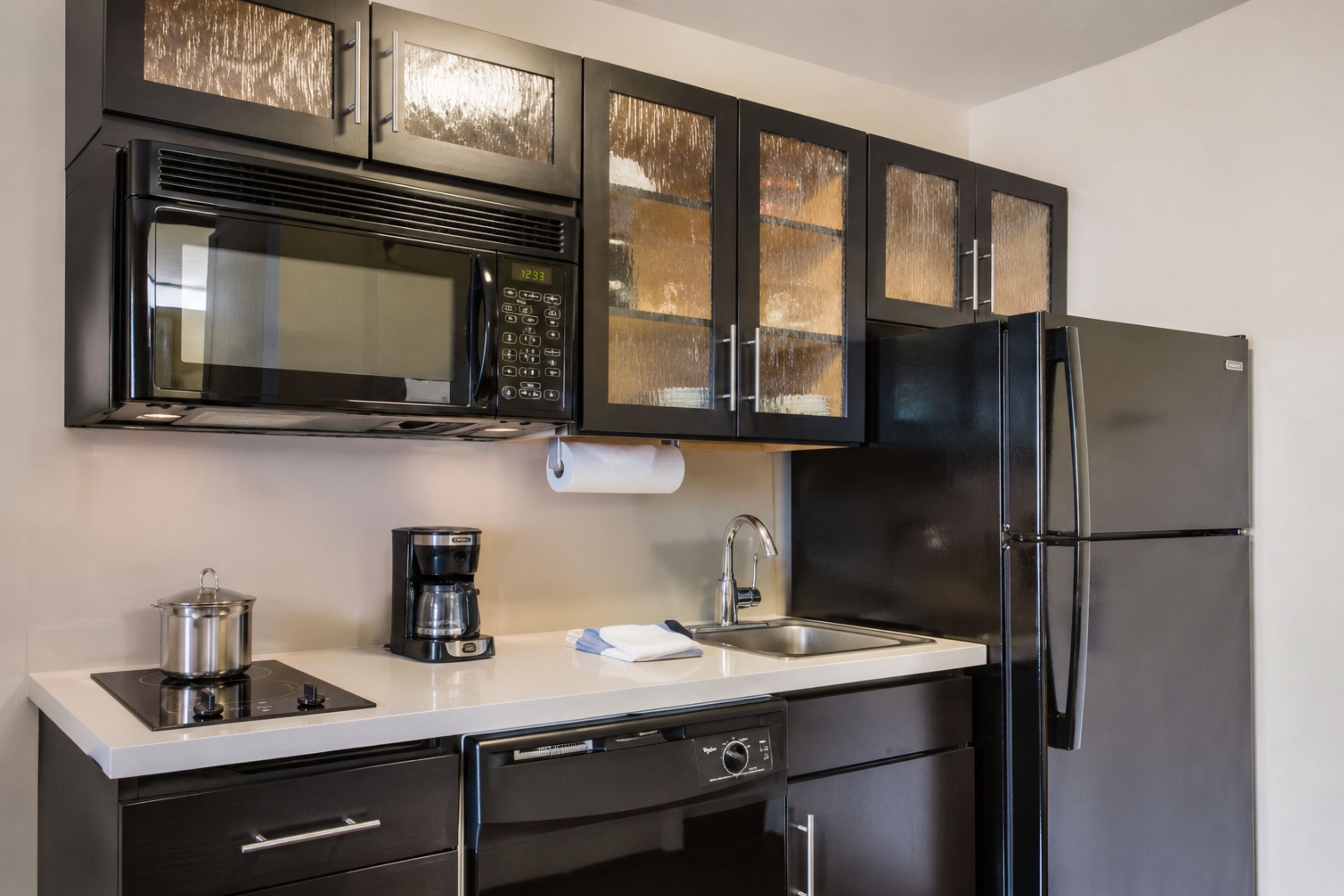 Coffee/tea maker, fridge, microwave, paper towels