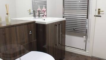 Hair dryer, towels, soap, toilet paper