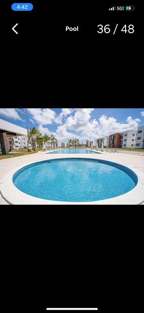 Outdoor pool - Haven Escape  2-bedroom condo with AC and private beach access in Punta Cana (Punta Cana)