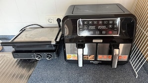 A kitchen with a toaster and a coffee maker.