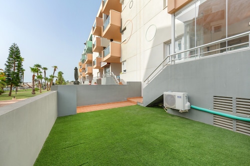 Appartement premium familial à Almerimar, vue sur jardin et piscine