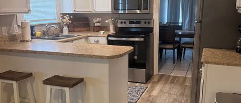Coffee/tea maker, fridge, microwave, oven