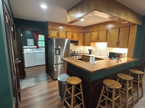 Cozy woodland retreat with modern comforts and rustic charm.