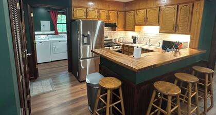 Cozy woodland retreat with modern comforts and rustic charm.
