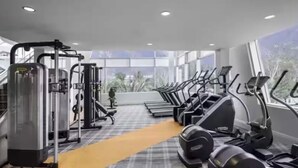A gym with treadmills, ellipticals, and weight machines. - Luxury stay in heart of W Hollywood with free parking & pool (West Hollywood)