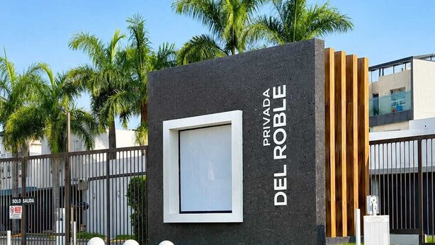 A modern building with a prominent sign reading 'PRIVADA DEL ROBLE.' - Entire House | Escobedo | North Monterrey (Ciudad General Escobedo)