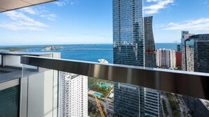A high-rise building with a view of the ocean and a bridge. - 6BD Brickell Penthouse Combo (Miami)