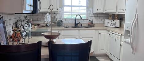 Coffee/tea maker, fridge, microwave, oven