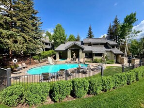 A residential property with a swimming pool, outdoor seating, and a fenced yard. - Beaver Creek Escape | Hot Tub, Shuttle, Sleeps 10 (Beaver Creek)