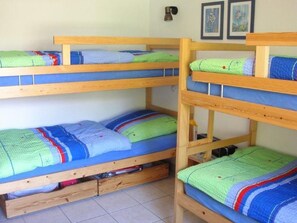 A bunk bed room with two beds, each with a pillow and a blanket. - Residence Fewo SARAH, (Grächen), 2031 by Interhome (Grächen)
