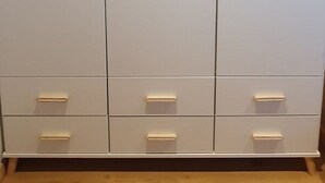 A large, white wardrobe with multiple drawers and doors, featuring a simple, modern design. - Silberblick, (Grächen), by Interhome (Grächen)