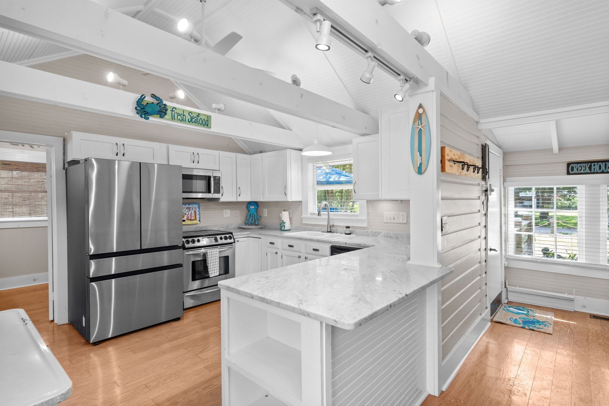 The kitchen boasts Quartz countertops & stainless steel appliances.