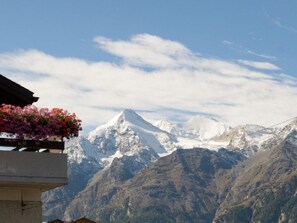 A mountain landscape with a snow-capped peak and a clear sky. - Ferienwohnungen Schmiedstube 420, (Grächen), by Interhome (Grächen)