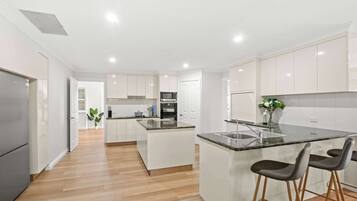 Coffee/tea maker, fridge, microwave, oven