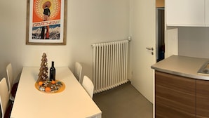 A small, modern kitchen with white cabinets and a white countertop. - Soldanella, (Grächen), by Interhome (Grächen)