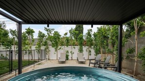 A covered outdoor swimming pool with lounge chairs and a pergola. - Sunny Nest |Cowboy Pool & Bacyard| Newly Renovated (La Puente)