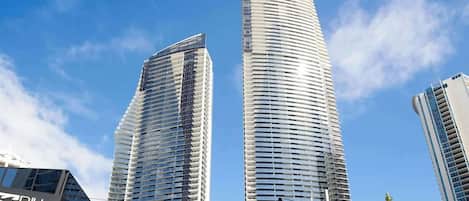 Two high-rise buildings with a clear sky.