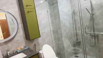 Apartment, 1 King Bed, City View | Bathroom | Combined shower/tub, free toiletries, towels, soap