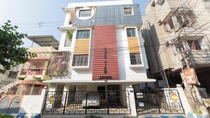 A multi-story building with a prominent red sign reading 'Lake View Abuna.' - Elara Residences by Jadecaps2bhknr IIM Kolkata (Alipur)