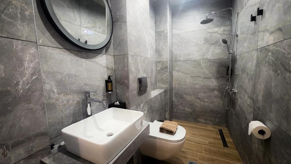 Shower, slippers, towels, soap