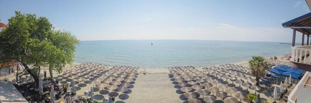 On the beach, white sand, beach umbrellas, beach bar