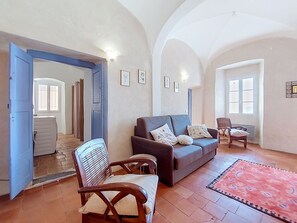A spacious living area with a sofa, chairs, and a patterned rug. - Casa Memmi Mouriès by Interhome (Palasca)