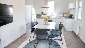 Deluxe Apartment, Balcony | In-room dining