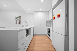 Fridge, microwave, oven, stovetop - Across from Train &Bus Station | Pool & Gym & View (Mitchelton)