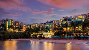 A beachfront hotel with multiple buildings, palm trees, and a beach in the foreground. - St. Thomas 2BR Oceanside Villa at Marriott’s Frenchman’s Cove – Beach & Resort A (Southside)