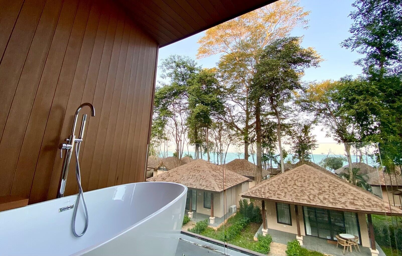 A modern bathroom with a freestanding bathtub and a showerhead.