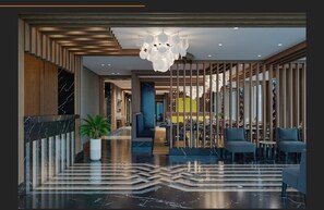 A modern lobby with a marble floor, a potted plant, a chandelier, and a seating area with tables and chairs. - Aspera Hotel Taksim (Istanbul)