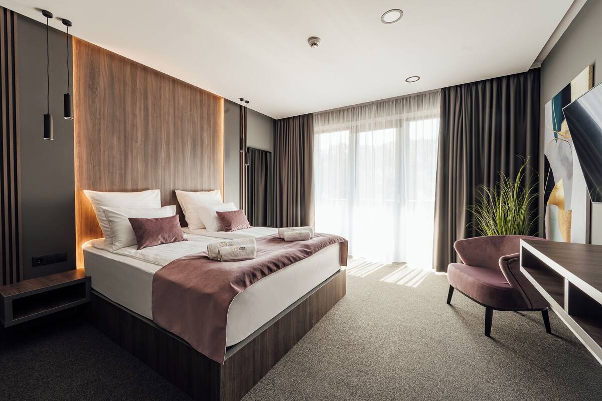 Deluxe Double Room, Balcony, Mountain View | In-room safe, desk, laptop workspace, blackout drapes
