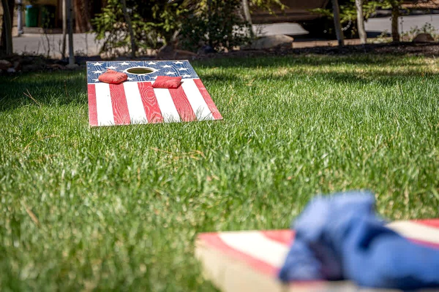 A lawn with a game board featuring a flag design.