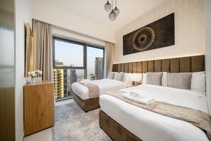 A hotel room with two beds, a large window, a view of buildings, and a modern art piece on the wall. - Gogoto9 Spacious 3BR Burj Khalifa view High Floor (Dubai)