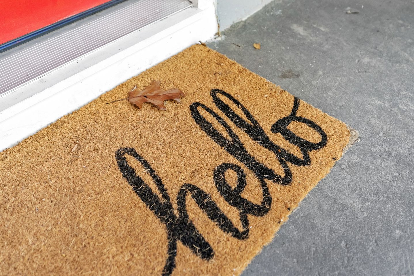 A doormat with the word 'Hello' written on it.