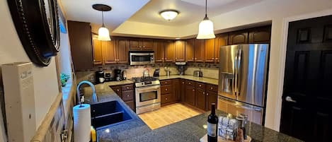 Coffee/tea maker, fridge, microwave, oven
