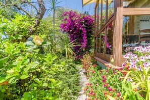 A garden path leading to a wooden structure with large windows. - A very spacious villa in Rapallo, situated in the hills just a 10-minute drive from the sea. Spanning 270 sqm across 3 independent levels, the villa accommodates up to 16 guests, making it ideal for large groups or families. The outdoor area offers every (Rapallo)