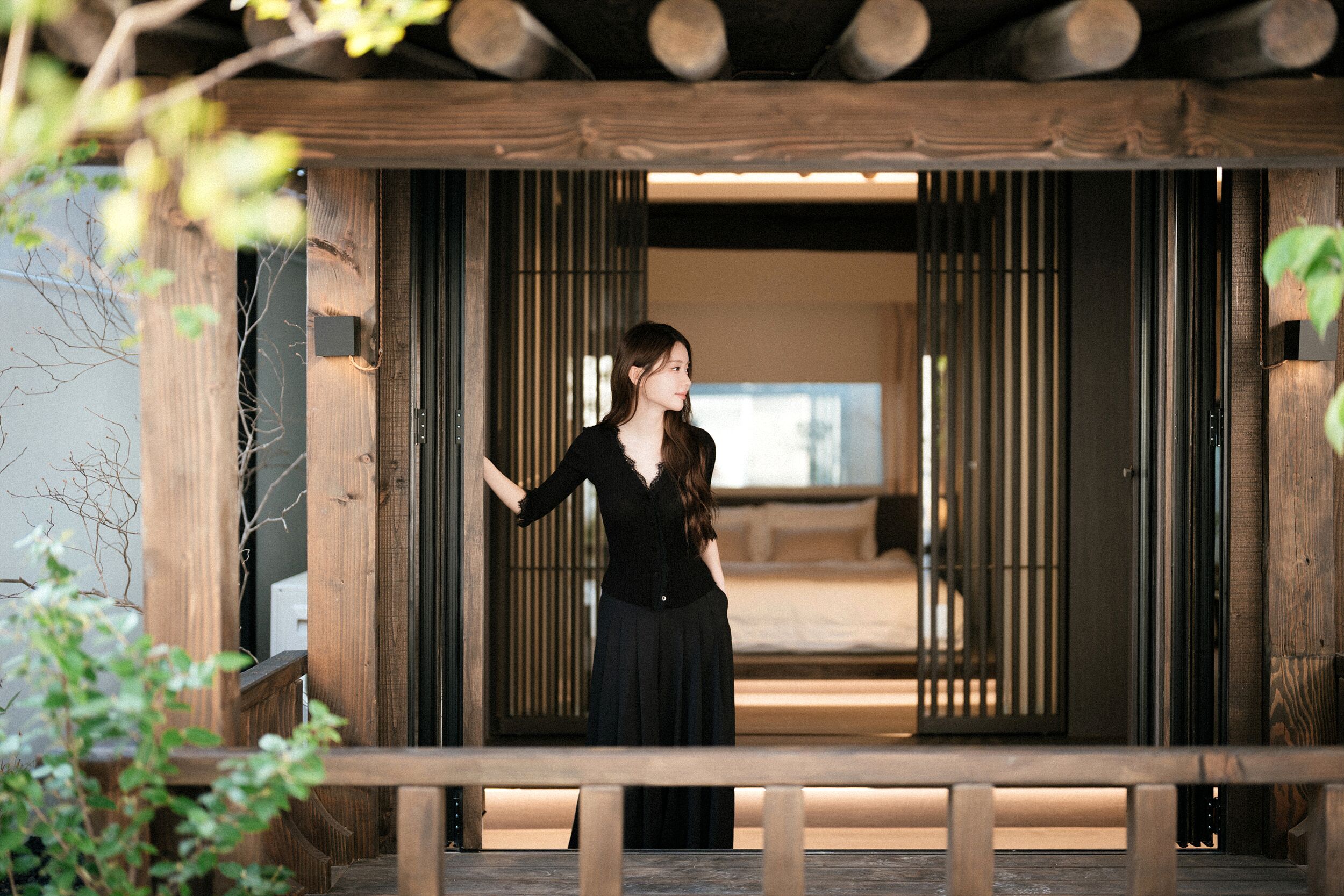 A traditional wooden structure with a person standing in front.