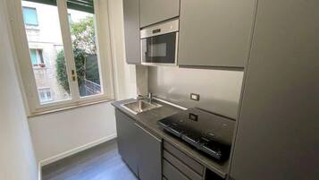 Fridge, microwave, stovetop, coffee/tea maker