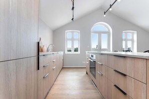 Fridge, microwave, stovetop, dishwasher - Amtmann Residence - Three Bedroom Penthouse (Selfoss)