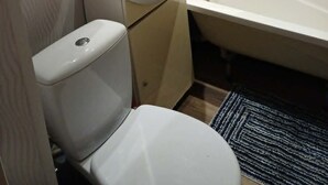 A bathroom with a toilet, sink, and bathtub. - 2-bedroom apartment in lovely Ventspils with air conditioning 1 (Ventspils)