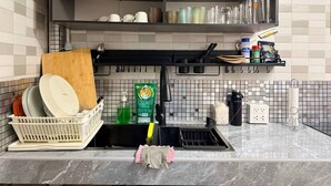 A kitchen with a dish rack, dish soap, a sponge, and a coffee maker. - Heaven of Pattaya, Entire Private 2 Floors, 3 Bedrooms for big Families! (Pattaya)