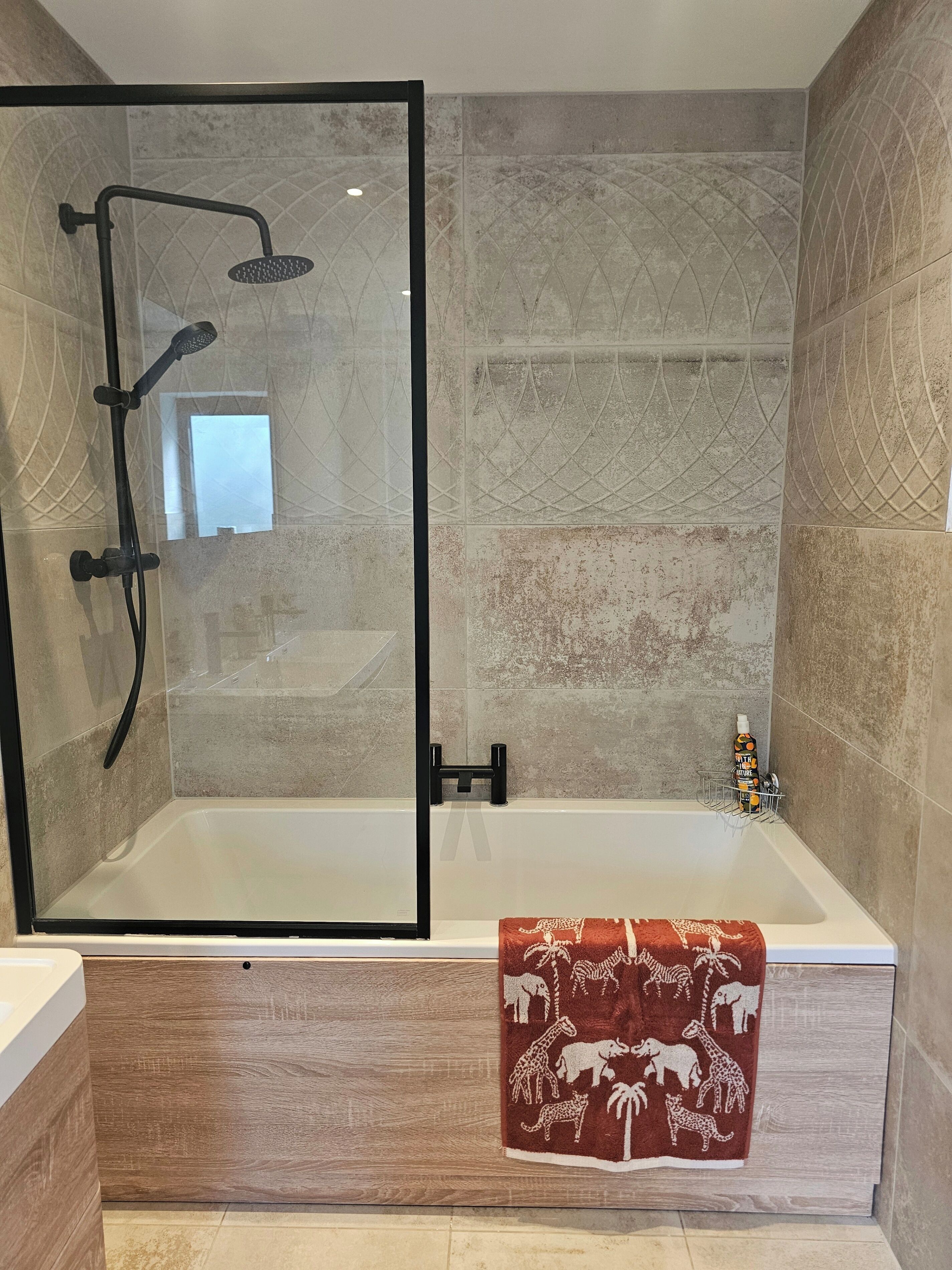 Combined shower/bathtub, deep-soaking bathtub, hair dryer, towels