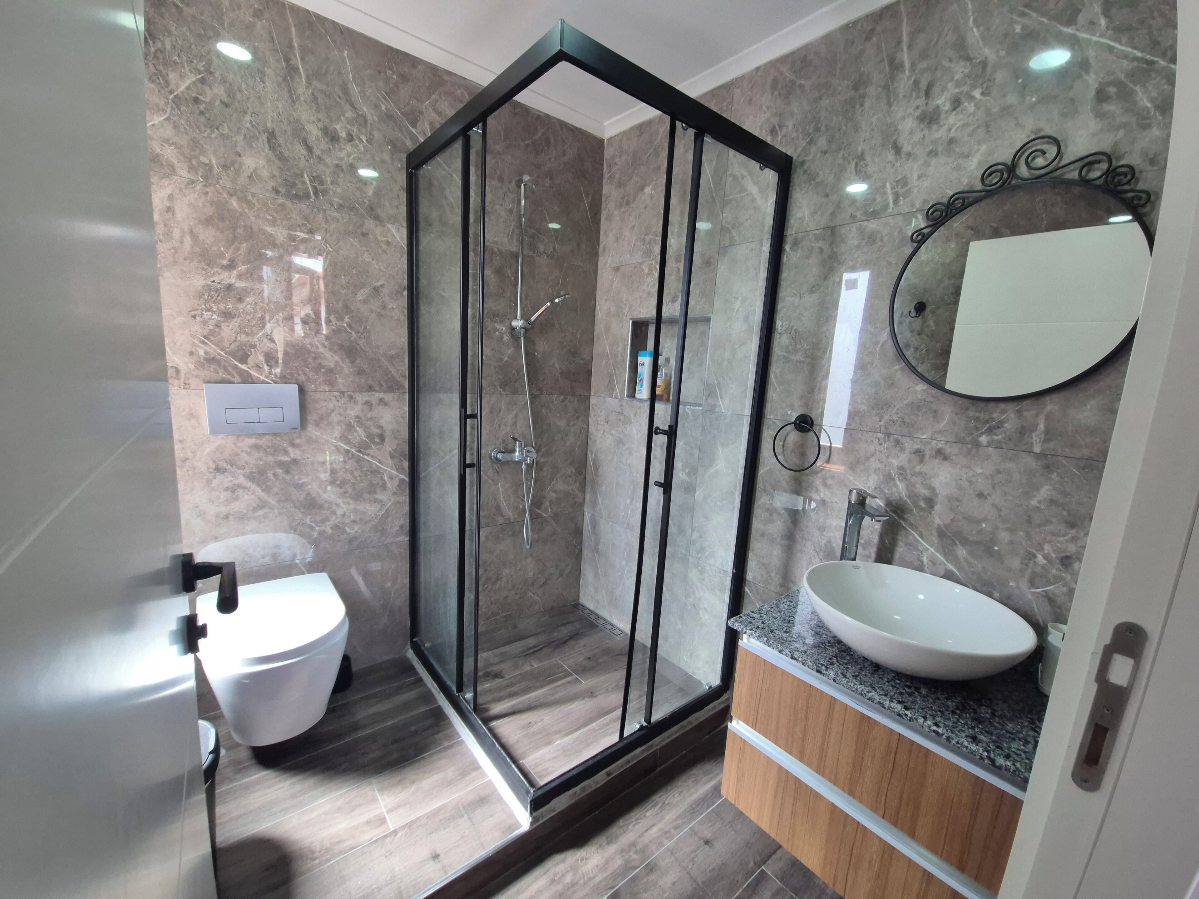 Shower, hair dryer, slippers, towels